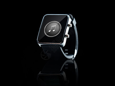 现代技术,媒体,象媒体黑色智能手表与音乐音符图标屏幕上的黑色背景图片