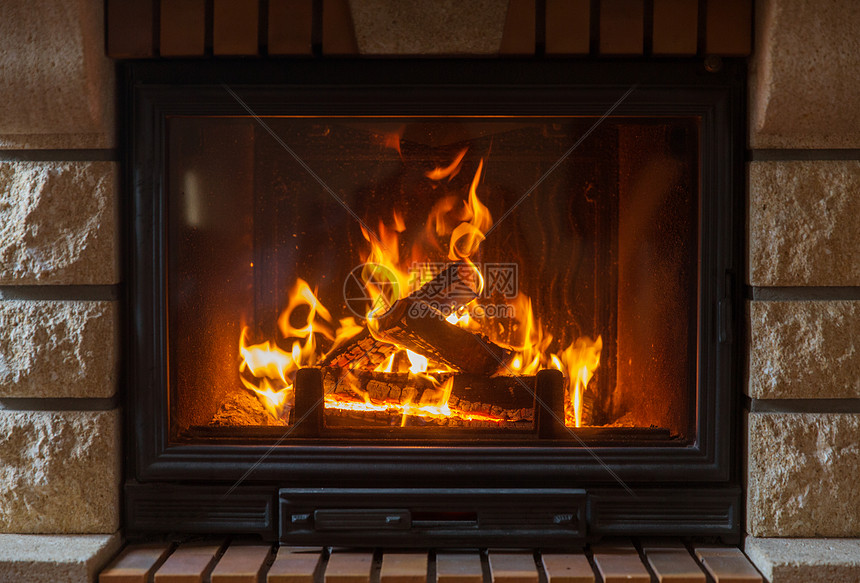加热,温暖,火舒适的燃烧的壁炉家里图片