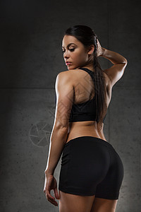 运动,健身,健美,举重人的轻妇女健身房摆姿势展示臀部图片