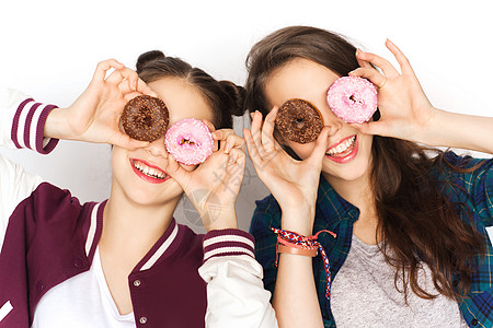 人,朋友,青少友谊的快乐的微笑,漂亮的十几岁的女孩与甜甜圈,脸玩得开心图片
