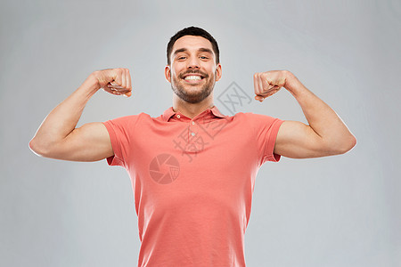 力量,健身,运动人的快乐微笑的轻微笑的人头肌灰色的背景图片