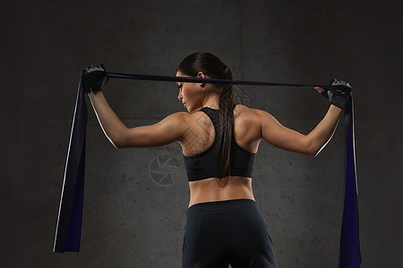 健身,运动,训练,人生活方式的妇女运动与扩张器阻力带健身房背景图片