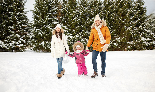 父母,时尚,季节人的快乐的家庭与孩子穿着冬天的衣服走户外图片