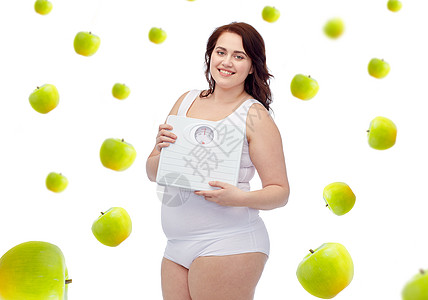 减肥,饮食,健康饮食人们的快乐的轻加上大小的女人穿着内衣,青苹果的背景下鳞片图片