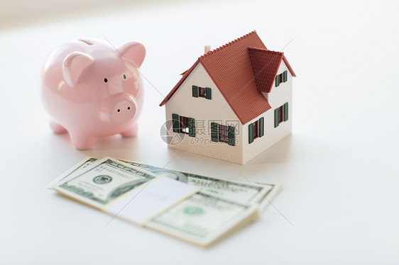 抵押贷款,投资,房地产财产家庭房屋模型,美元货币储蓄罐图片
