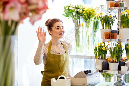人,手势,商业,销售花卉快乐微笑的花店妇女挥手花店现金箱图片