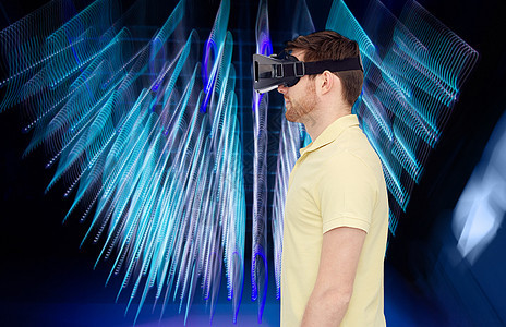 三维技术,虚拟现实,娱乐活动人的轻人与虚拟现实耳机3D眼镜螺旋霓虹灯背景图片