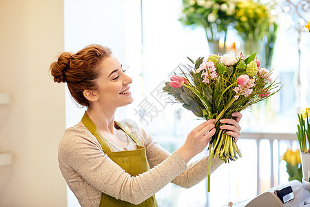 人,商业,销售花卉快乐微笑的花店妇女花店图片