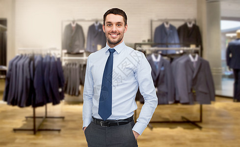商业,人,男装,销售服装快乐的轻商人的服装店背景图片