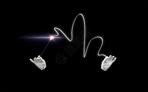 表演,幻想,马戏,表演魔术师的手手套与照明魔杖魔术黑色背景图片