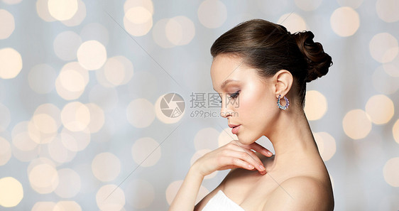 美丽,珠宝,配件,人奢侈的美丽的亚洲妇女的脸与耳环假日灯光背景图片