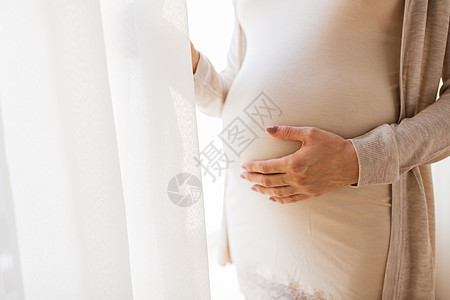 怀孕,母亲,人期望密切孕妇的腹部手图片