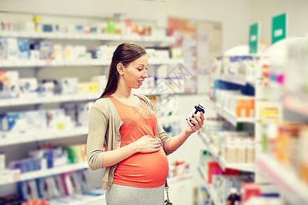 怀孕,医学,药剂学,保健人们的快乐孕妇阅读标签上的药罐药房图片