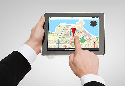 商业,导航,互联网技术近距离的人手平板电脑电脑与GPS导航屏幕上图片
