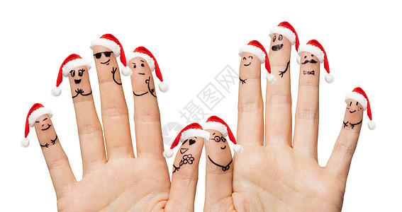 诞节,家庭,假日,人身体部位的特写两只手,露出微笑的手指图片
