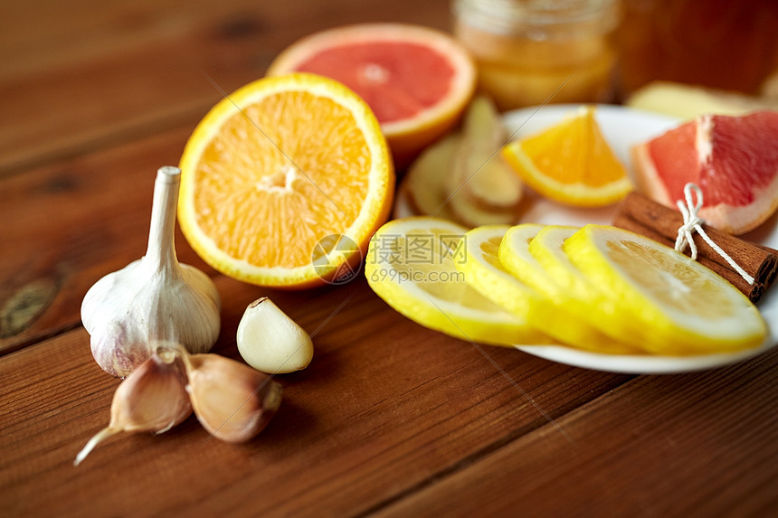 健康,传统医学民族科学大蒜,柠檬,橙色等民间补救木制背景图片
