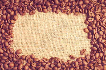 洒麻布纺品上的咖啡豆框架咖啡豆框架图片