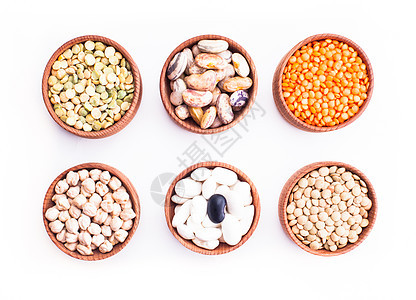 同类型的豆子木制碗中分离白色上豆子的类型图片