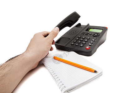 白色背景上的黑色IP电话笔记本钢笔高清图片