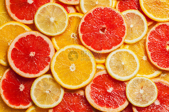 柑橘类水果片背景图片
