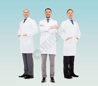 医疗保健,职业医学微笑的男医生穿着白色外套,蓝色背景图片
