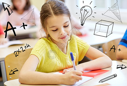 教育,小学,学人的群学校的孩子课堂上涂鸦进行笔记本写作测试图片