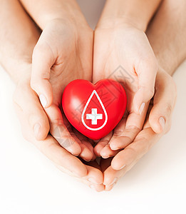 医疗保健医药献血男女手着红色的心脏捐献者的标志背景图片