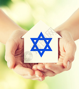 宗教,犹太教慈善密切的女人手房子与大卫的明星绿色背景图片