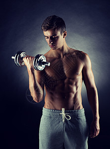 运动,健美,训练人的轻人哑铃弯曲肌肉灰色背景图片