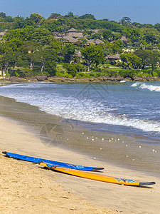 热带沙滩冲浪板,吉姆巴兰,巴厘岛,印度尼西亚图片