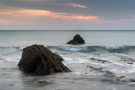 日落景观海景的岩石海岸线希望湾英国图片