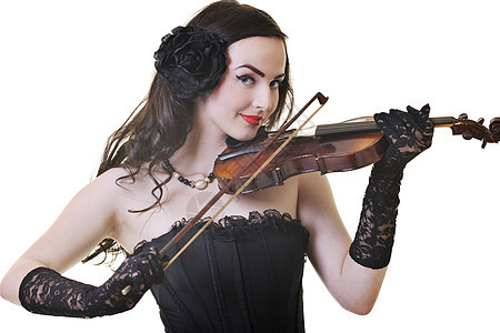 美丽的轻快乐的女人白色上演奏小提琴乐器图片