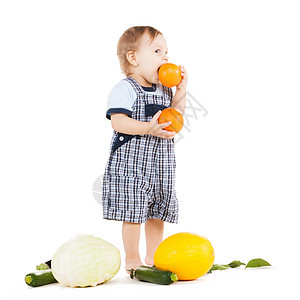 童健康的食物可爱的幼儿与蔬菜吃橙色图片