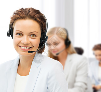 商业,通信呼叫中心的女帮助热线运营商与耳机图片