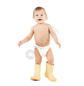 童玩具可爱的小男孩穿着大橡胶靴走路图片