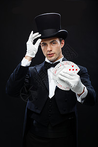 魔术,表演,马戏,扑克,表演魔术师戴着顶帽表演扑克牌图片