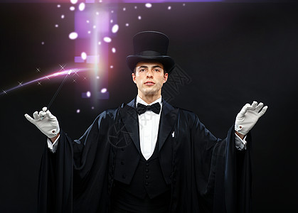 表演,马戏,表演魔术师戴着顶帽子,魔杖表演魔术图片