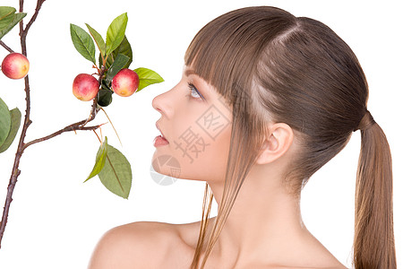 可爱的女人带着苹果树枝的照片图片