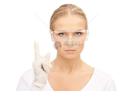 戴防护眼镜手套的女人的明亮照片图片