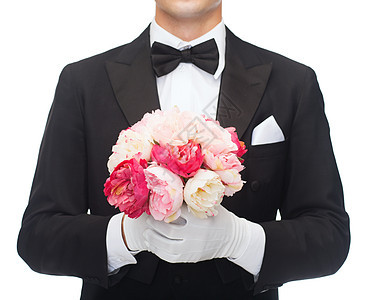 婚礼,周纪念,特殊场合的特写男人的尾衣与花牡丹图片