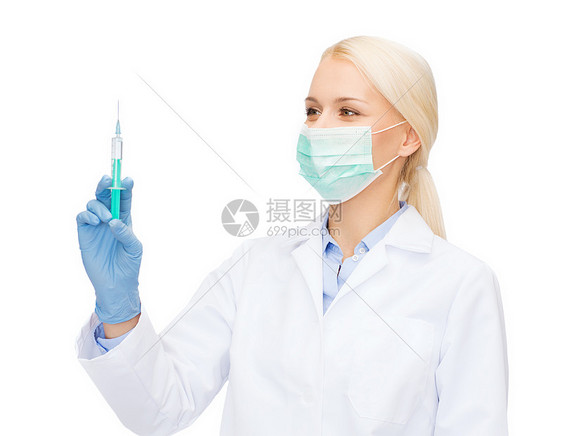 医疗保健医学女医生口罩持注射器与注射图片