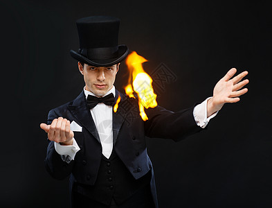 爆炸火焰魔术,表演,马戏,表演魔术师顶帽表演魔术与火背景