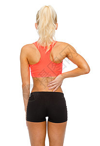 健身,医疗医学运动的女人抚摸她的背图片