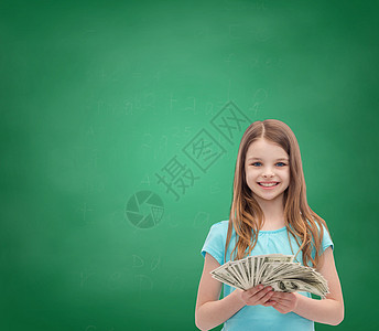 金钱,财务人的微笑的小女孩与美元现金钱背景图片