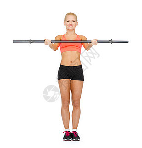 健身,运动节食的微笑的运动女人用杠铃锻炼图片