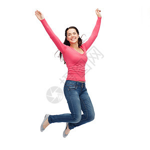 幸福自由运动人的微笑的轻女人空中跳跃图片