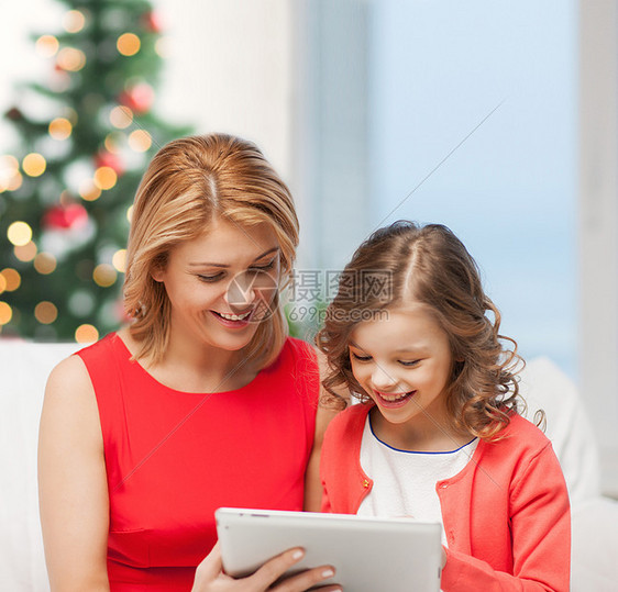 诞节,幸福,现代技术母亲女儿与平板电脑图片