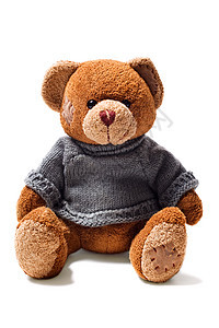 玩具泰迪棕熊与补丁绿色毛衣隔离白色背景图片