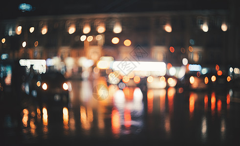夜晚模糊的城市博克美丽的抽象背景与分散的建筑,汽车,城市灯,人五颜六色的背景与城市夜景为了背景古图片