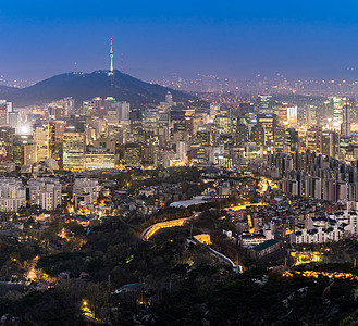 韩国首尔市中心城市景观的空中日落夜景与首尔塔首尔市中心城市景观夜景图片